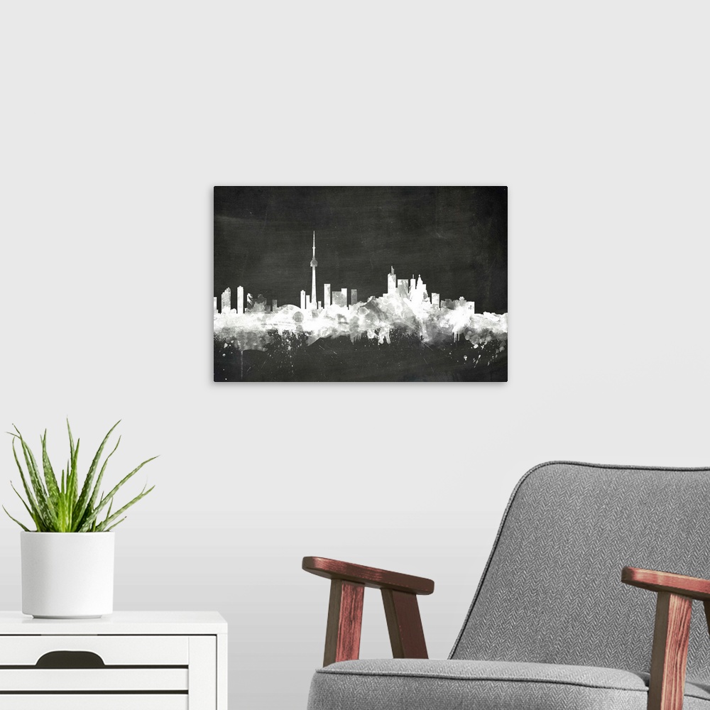 A modern room featuring Smokey dark watercolor silhouette of the Toronto city skyline against chalkboard background.