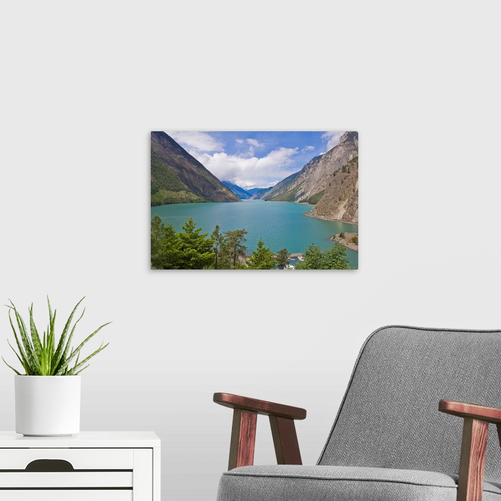 A modern room featuring Scenic mountains around the blue waters of Lake Louise.