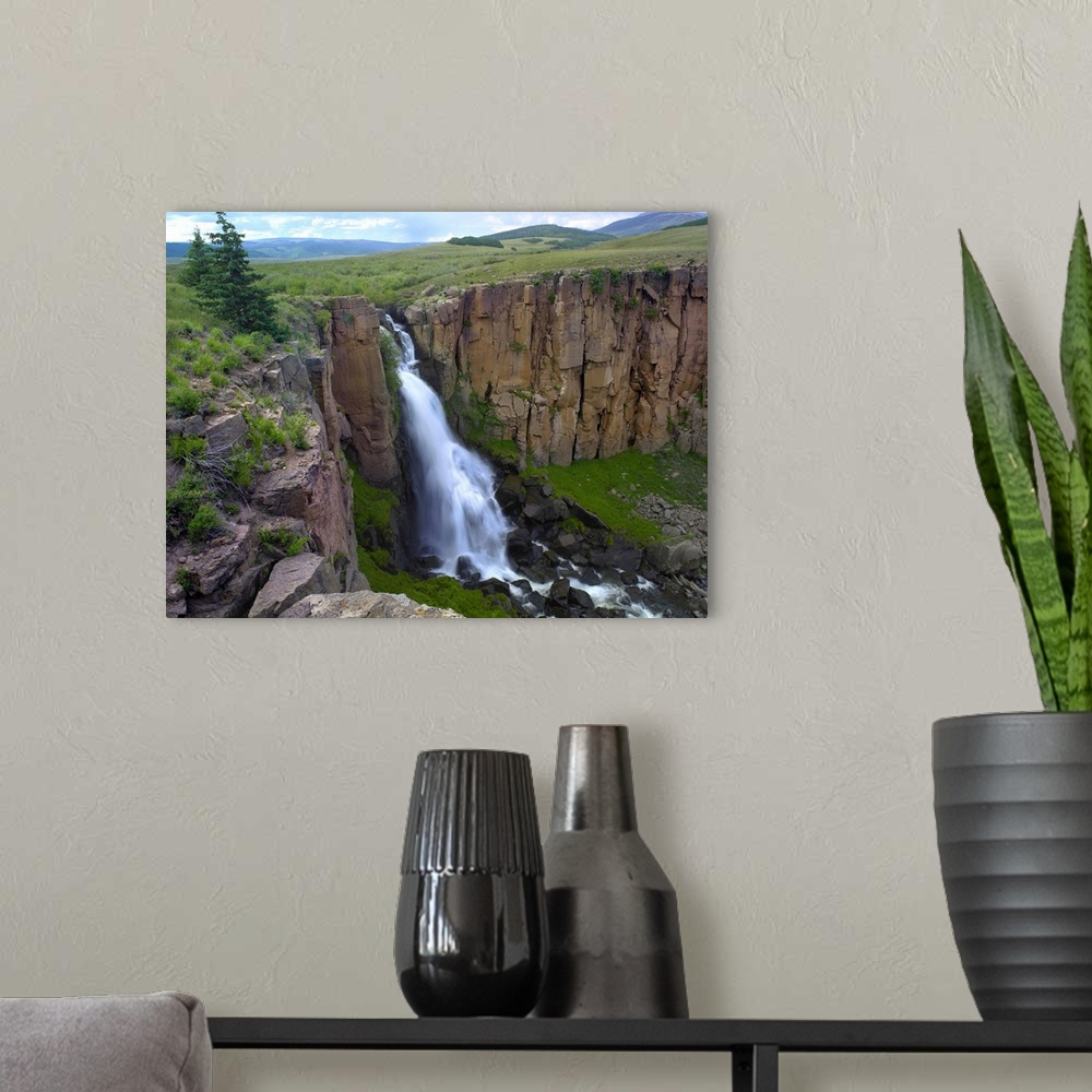 A modern room featuring North Clear Creek Waterfall cascading down cliff, Colorado