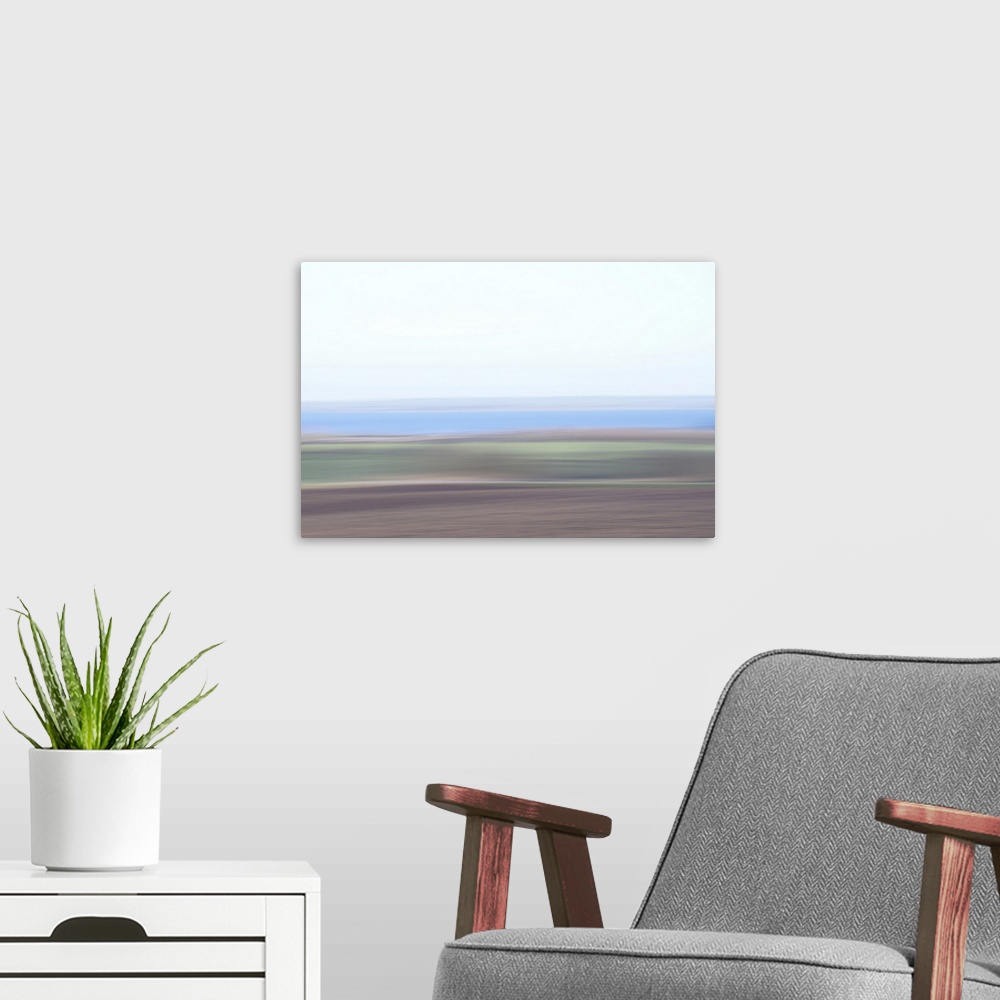 A modern room featuring Artistically blurred photo. Early in the morning on a winter day on the borders of the lake Limfj...