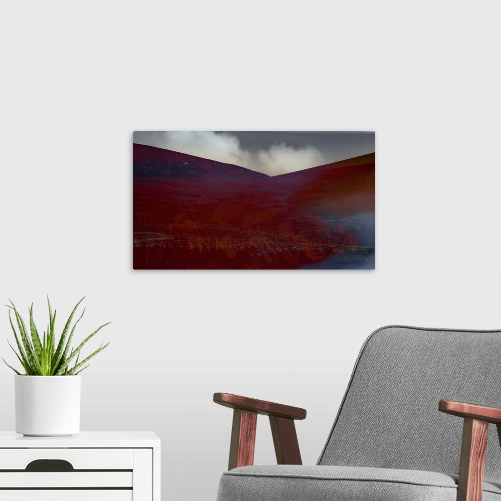 A modern room featuring Photograph of an abstract landscape with rusted red hills and light trails, created with multiple...
