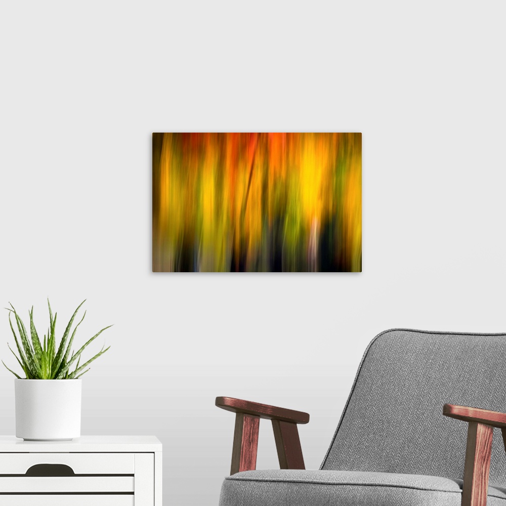 A modern room featuring Blurred artwork of what appears to be sunlight.