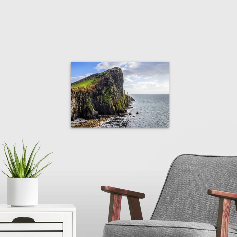 A modern room featuring Fine art photo of a rocky cliff overlooking the ocean.