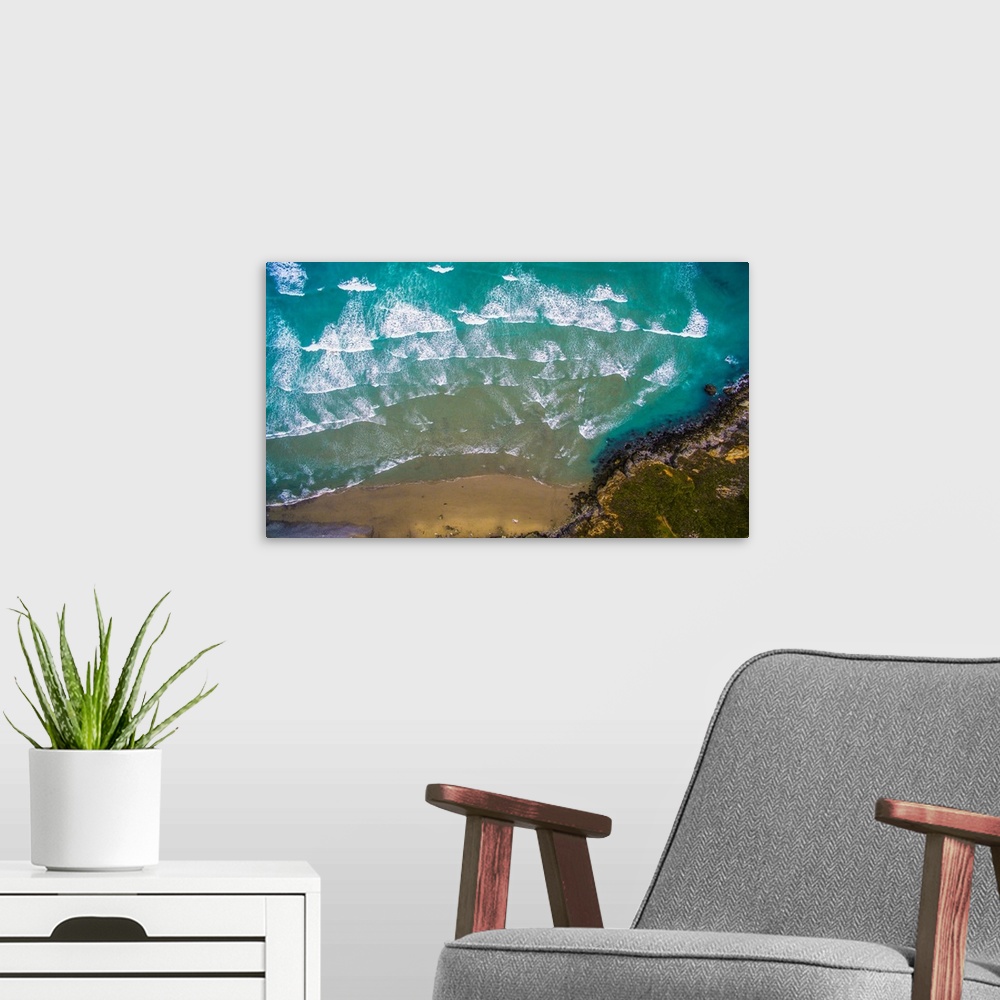 A modern room featuring Aerial view of ocean waves on beach, Big Sur, California, USA