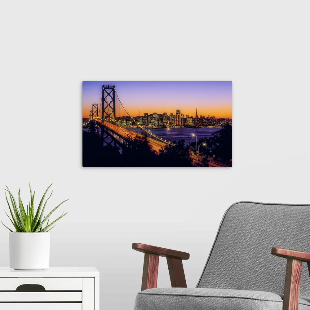 A modern room featuring Bay Bridge at dusk, San Francisco, California, USA