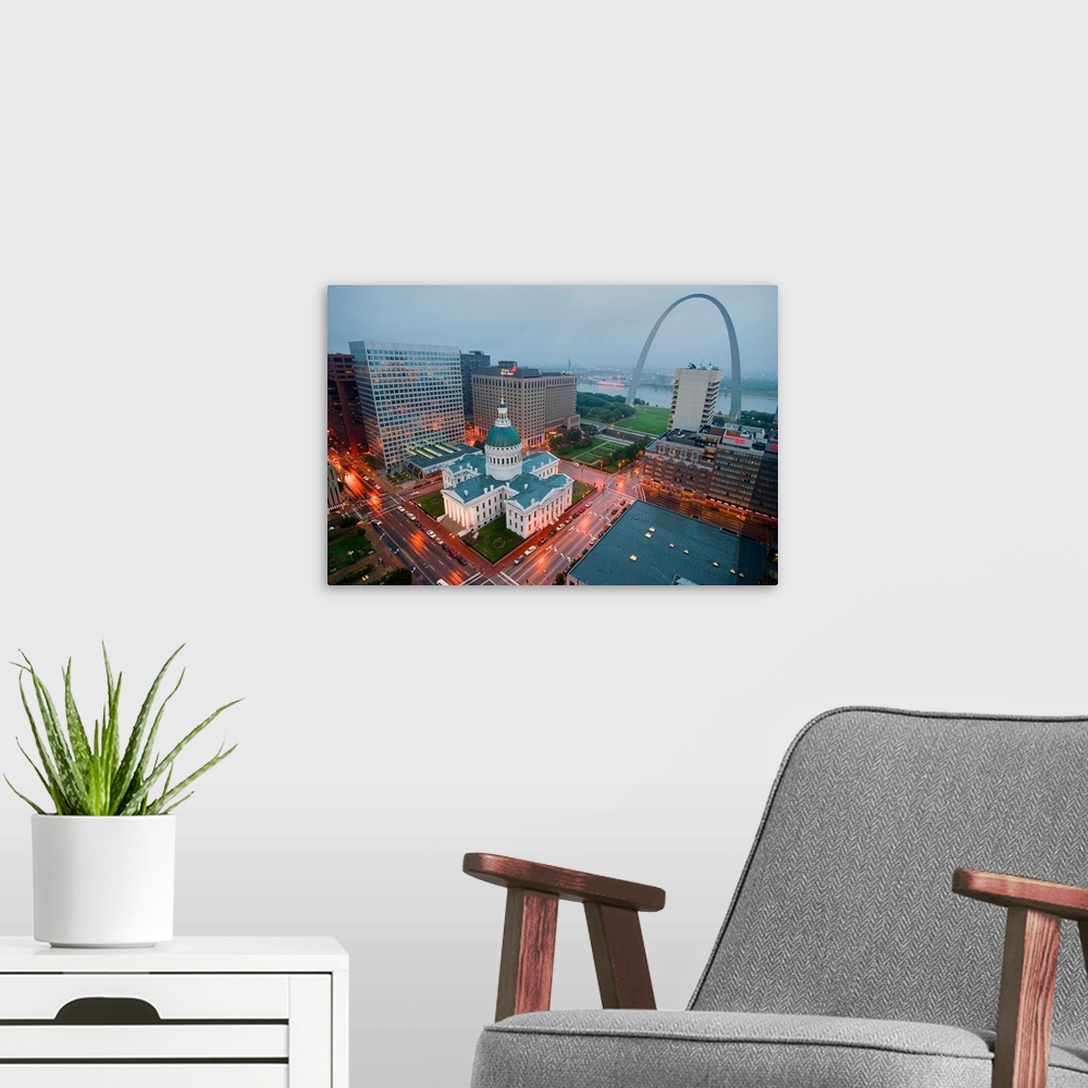 A modern room featuring In a misty rain an elevated view of Gateway Arch and the historical Old St. Louis Courthouse. The...