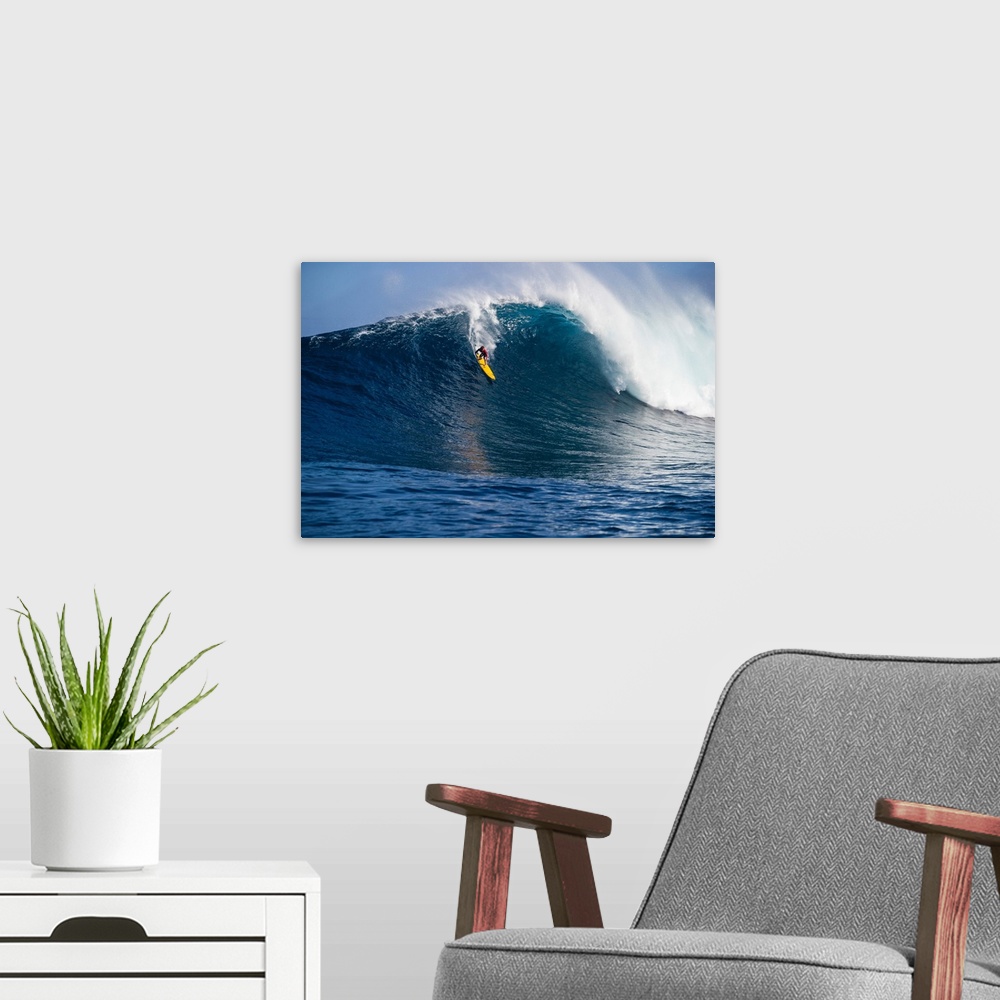 A modern room featuring Male surfer surfing wave in Pacific Ocean, Peahi, Hawaii, USA