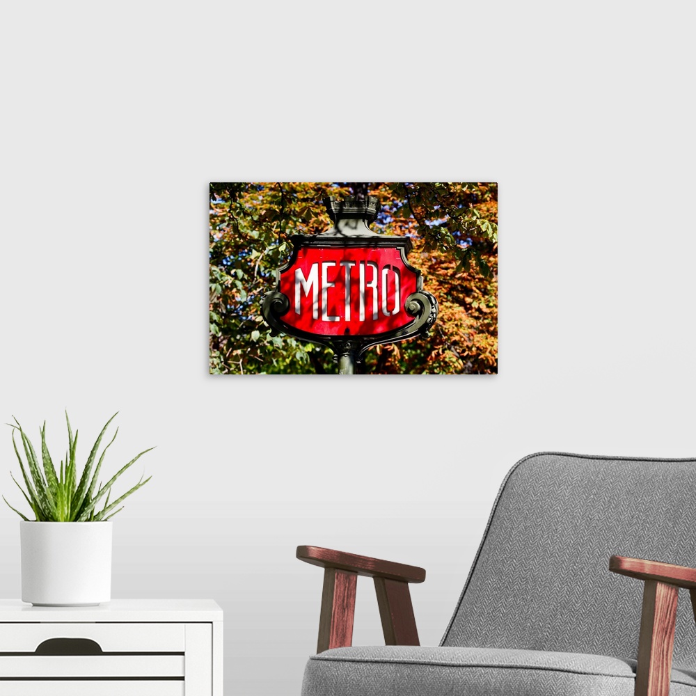 A modern room featuring Metro sign, paris, france.