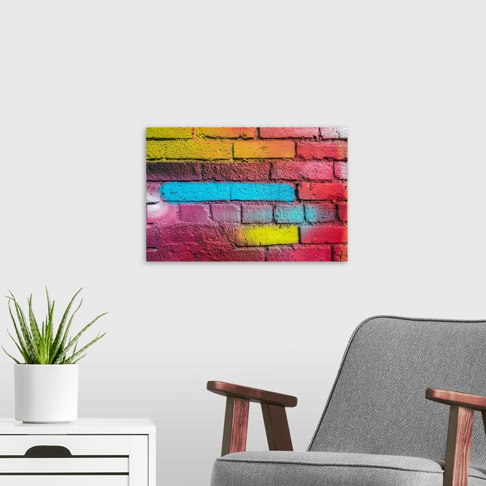 A modern room featuring Multi-colored brick wall.