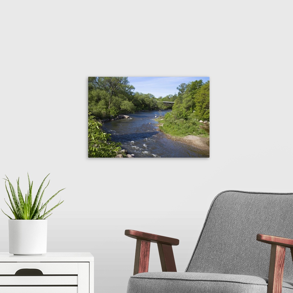 A modern room featuring River passing through a forest, Beaver River, Ontario, Canada