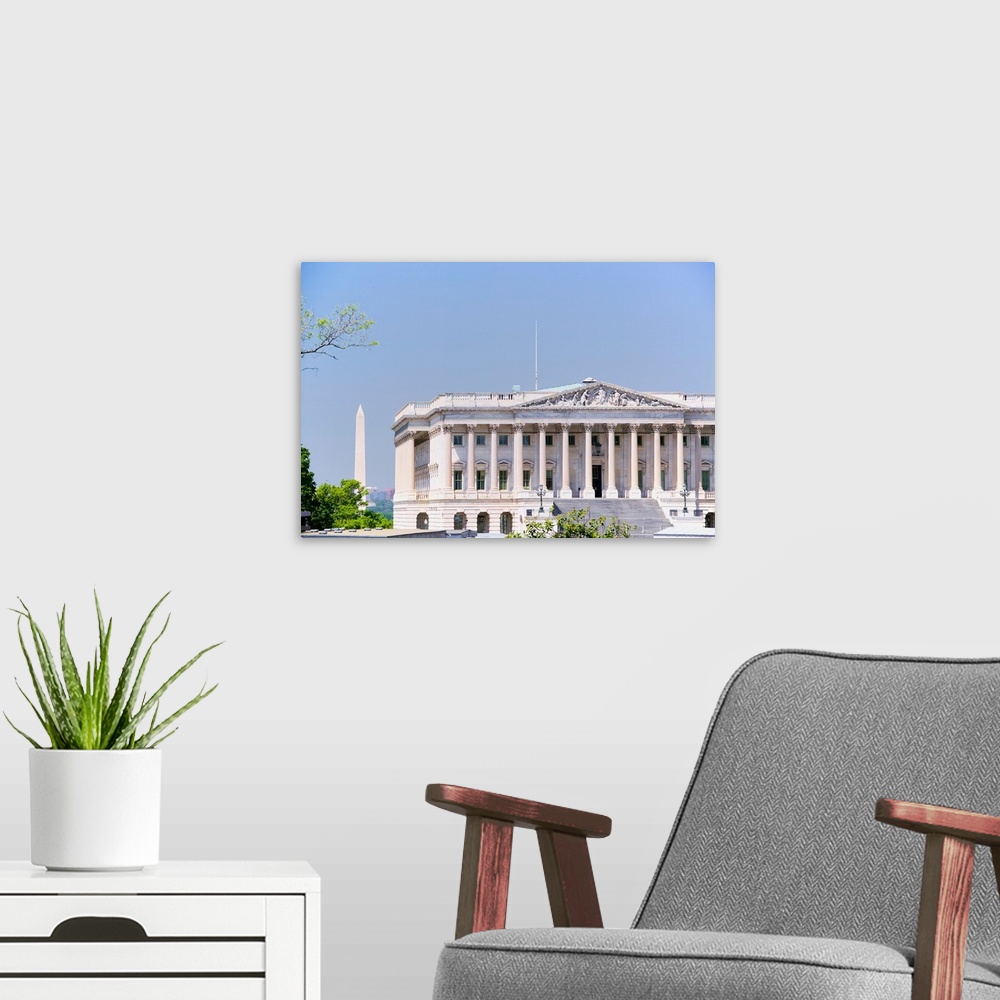 A modern room featuring U.S. Senate side of U.S. Capitol with Washington Monument in background, Washington D.C..
