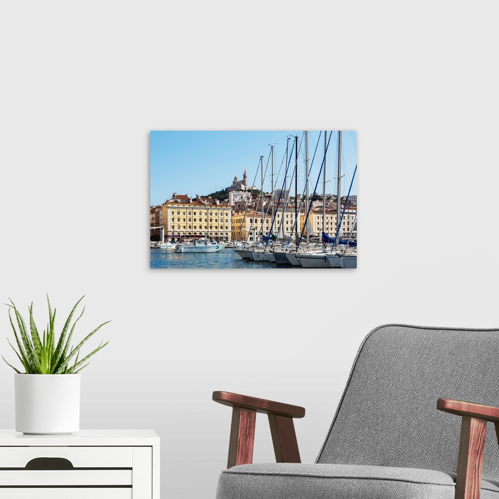 A modern room featuring Marseille, Provence-Alpes-Cote d'Azur, France. View across Vieux-Port, the Old Port, to the 19th ...