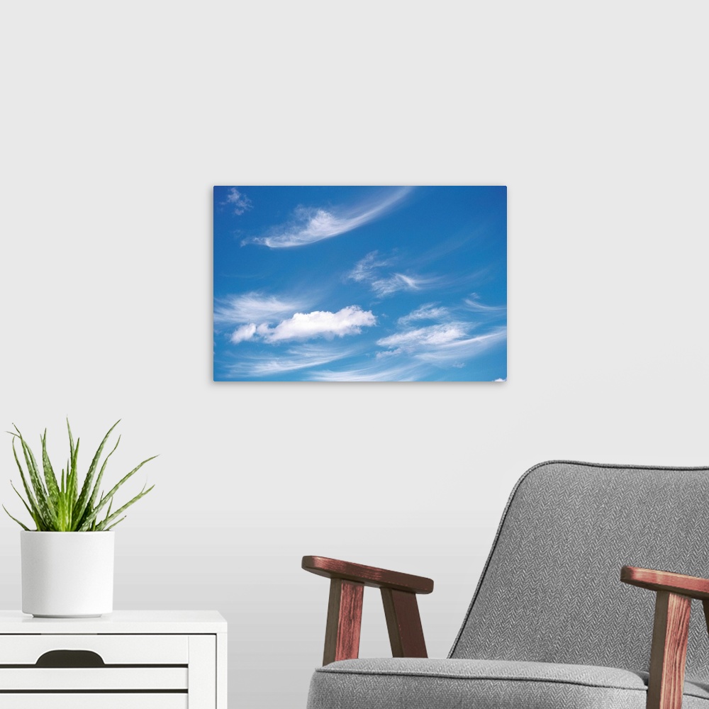 A modern room featuring Wispy Clouds in Sky