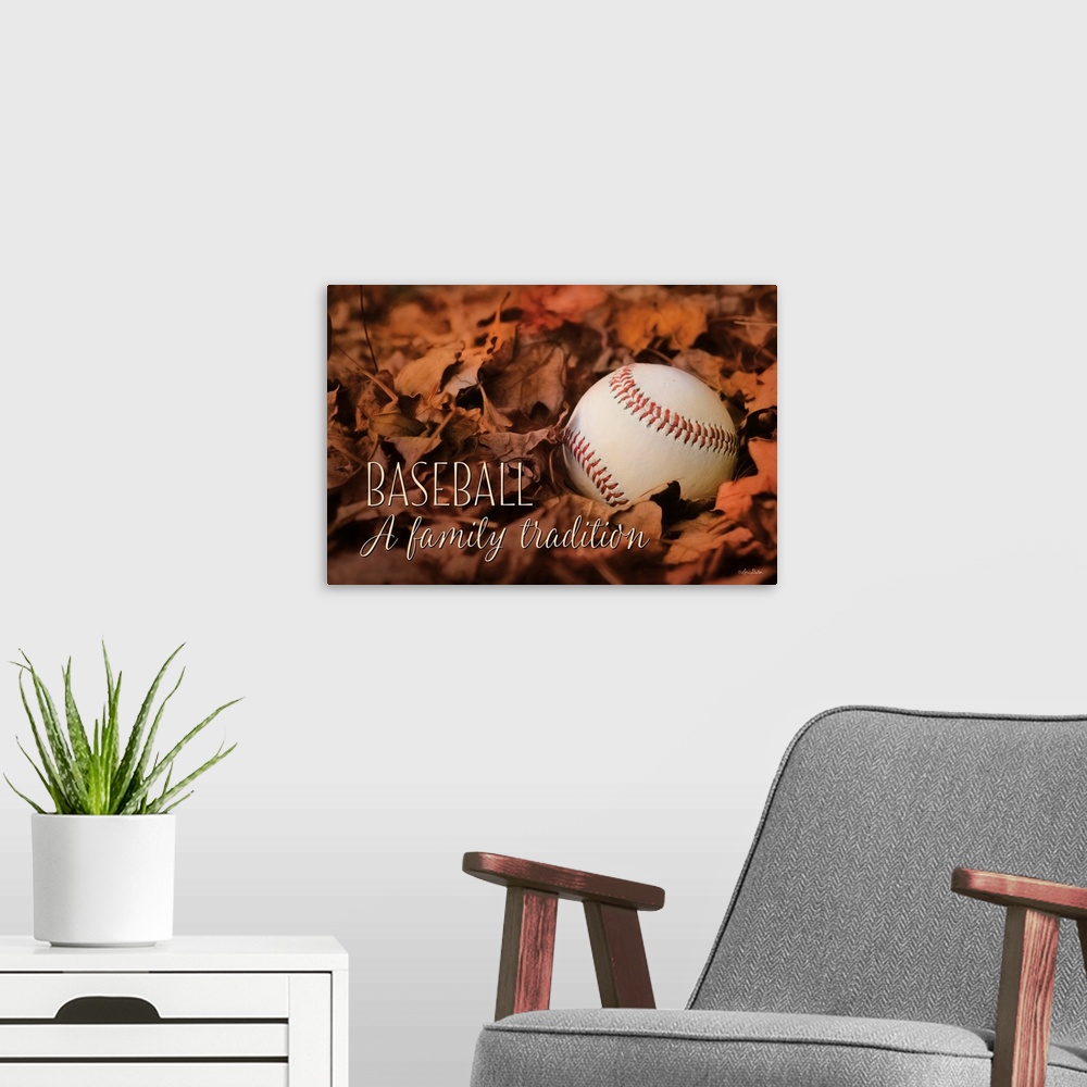 A modern room featuring Image of a baseball resting on fallen fall leaves.