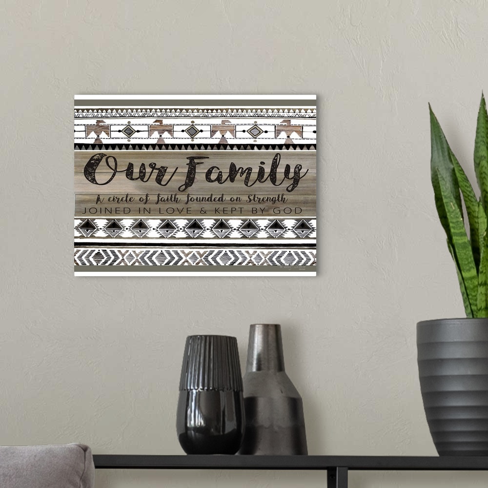 A modern room featuring Decorative artwork featuring geometric southwestern designs and a family sentiment.