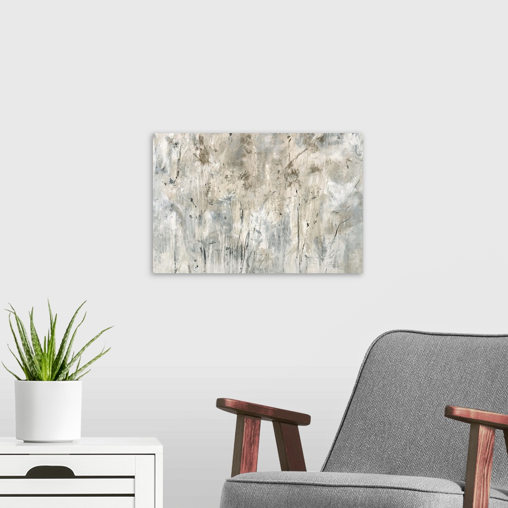A modern room featuring Neutral toned painting with faint abstract flowers spread out across the canvas.