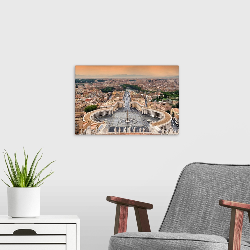 A modern room featuring It's a view of the Vatican City at sunset.