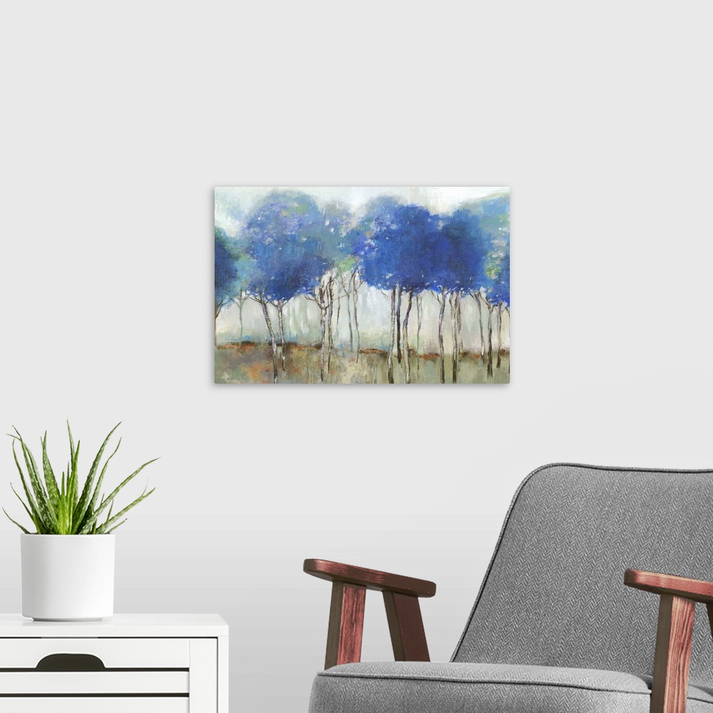 A modern room featuring Abstract painting of a forest of brilliant blue trees.