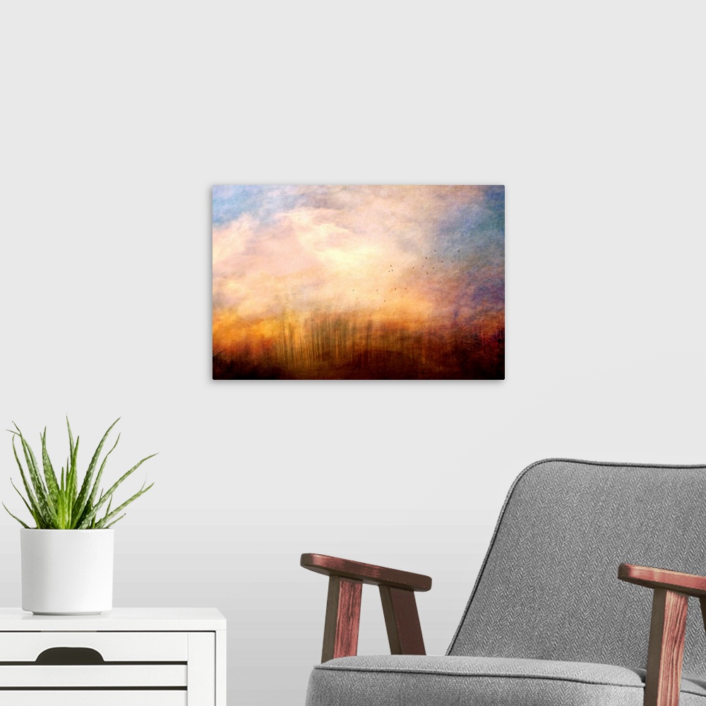 A modern room featuring A fine art photograph of a cloud plume dominating the sky as distant birds fly up out of the gras...
