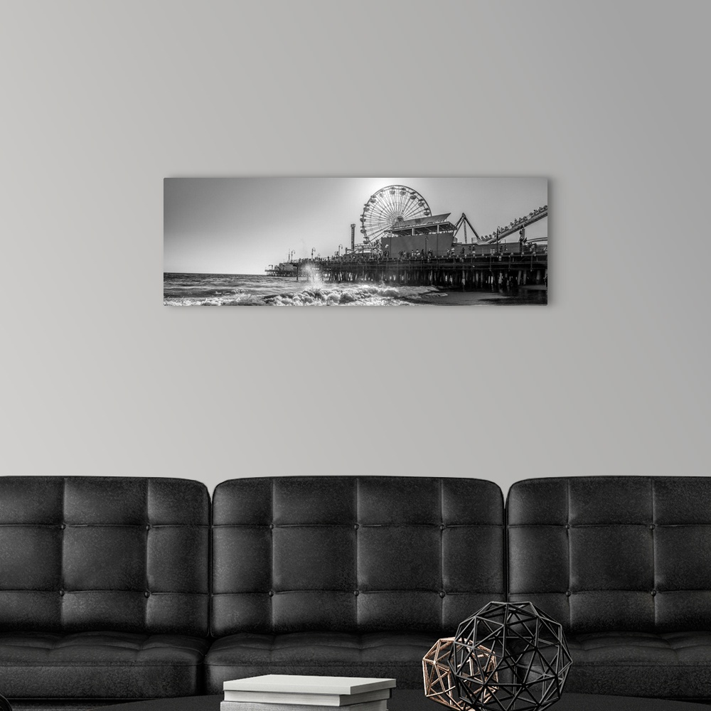 A modern room featuring Panoramic photograph of the Santa Monica Pier in Los Angeles, California, with the sun setting ri...