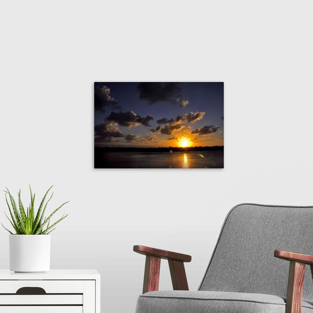 A modern room featuring The sun setting over the Intracoastal Waterway.