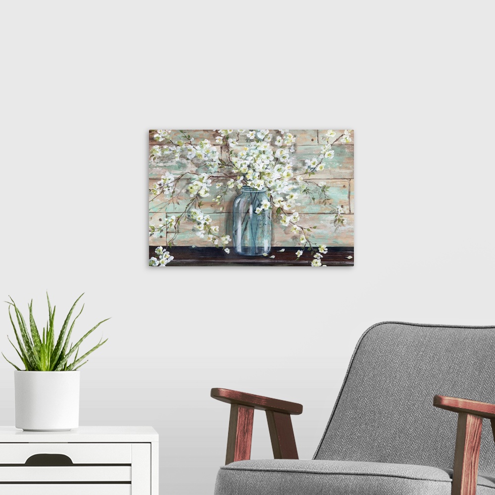 A modern room featuring A decorative painting of a glass mason jar full of white blossoms in subdue tones.
