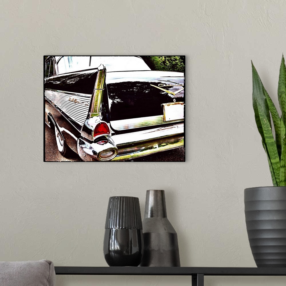 A modern room featuring Photograph of the back side of a vintage black Chevrolet Bel-Air.
