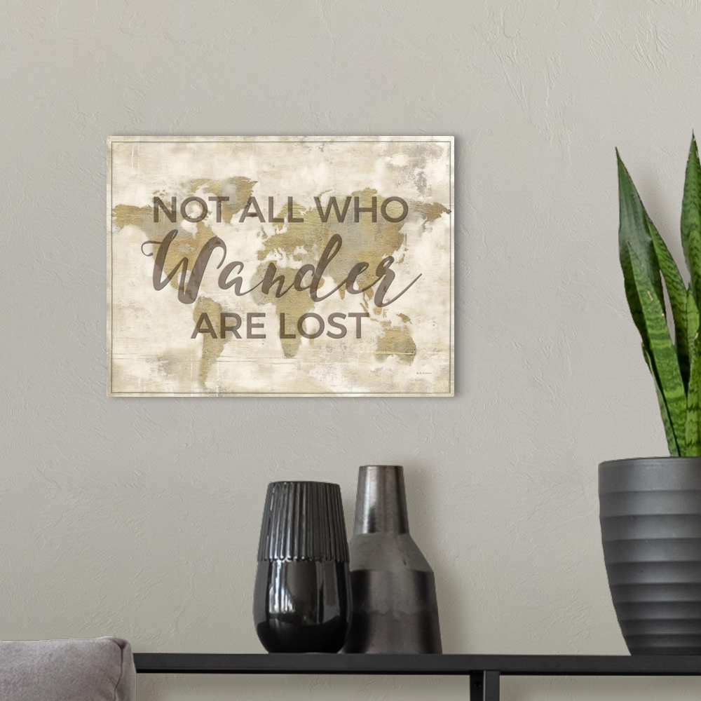 A modern room featuring "Not All Who Wander Are Lost" on a world map in gold with a distressed appearance.