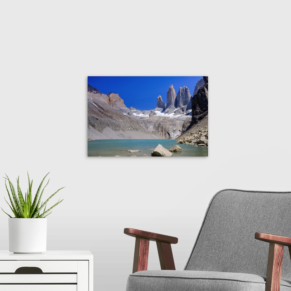 A modern room featuring A glacial lake and the rock towers that give the Torres del Paine range its name, Torres del Pain...