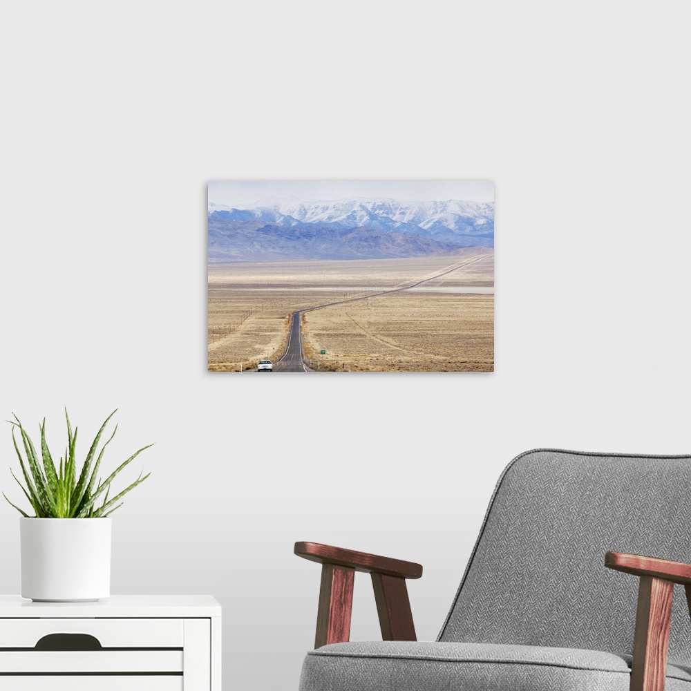 A modern room featuring A never ending straight road on US Route 50, the loneliest road in America, Nevada