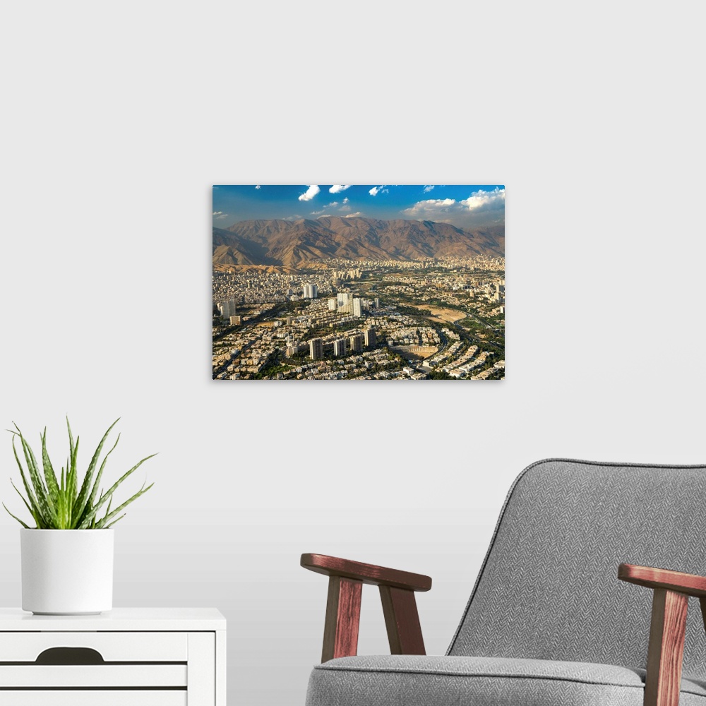 A modern room featuring Aerial view of Tehran facing North towards the Alborz Mountains, Tehran, Iran, Middle East