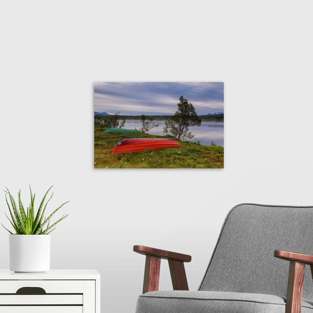A modern room featuring Boats on green meadows frame the calm water at night, Bogen, Evenes, Ofotfjorden, Nordland, Norwa...