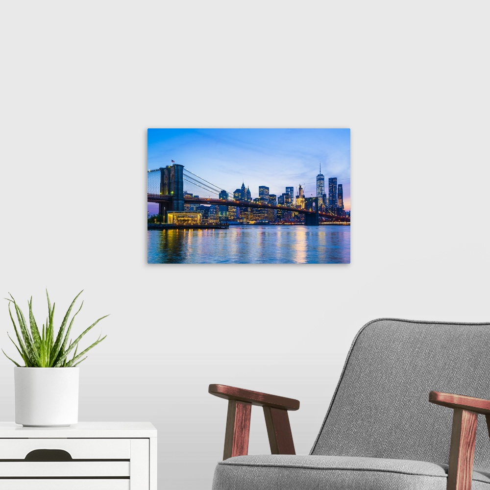 A modern room featuring Brooklyn Bridge and Manhattan skyline at dusk, New York City, United States of America, North Ame...