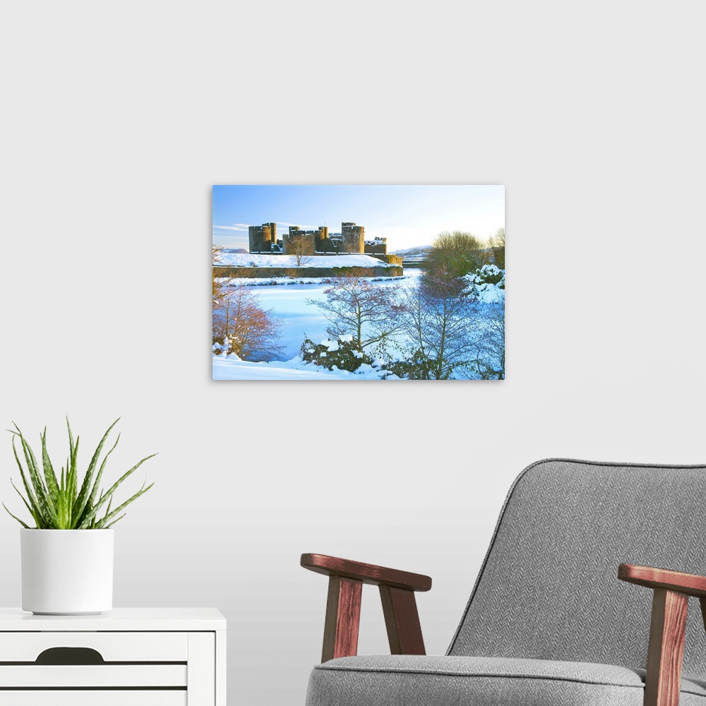 A modern room featuring Caerphilly Castle in snow, Caerphilly, near Cardiff, Gwent, Wales