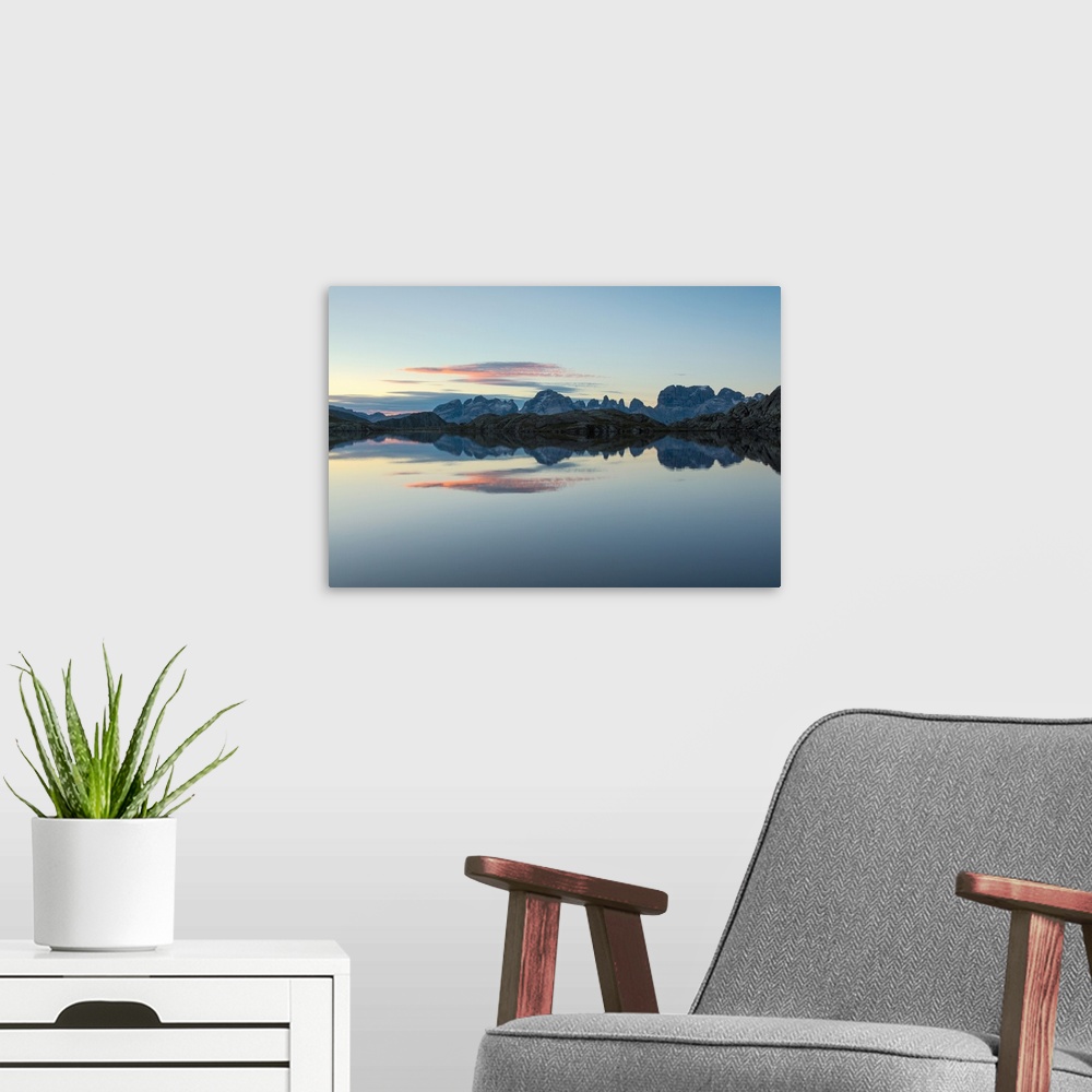 A modern room featuring Blue sky and pink clouds reflected in Lago Nero at dawn, Cornisello Pinzolo, Brenta Dolomites, Tr...