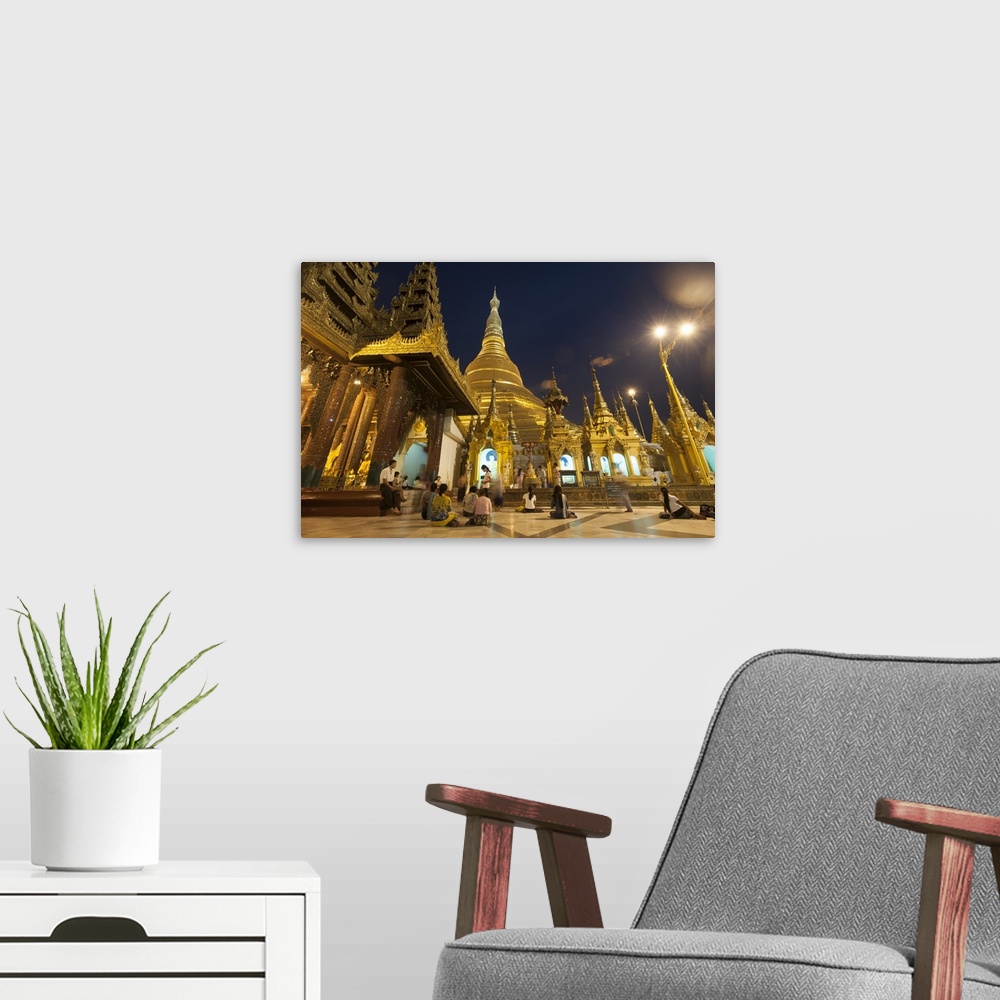 A modern room featuring Devotees come to pray at Shwedagon Pagoda, Yangon, Myanmar