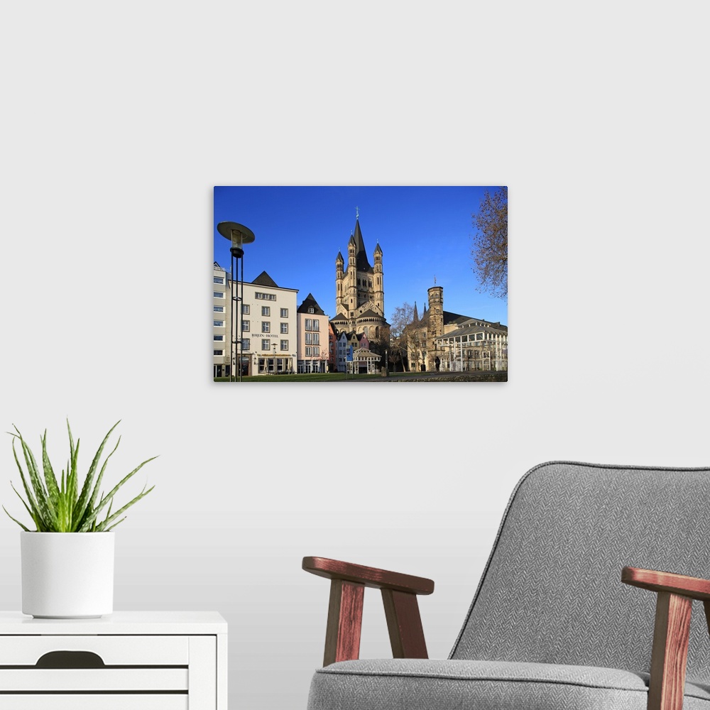 A modern room featuring Fischmarkt Square with Church of Gross St. Martin, Cologne, North Rhine-Westphalia, Germany