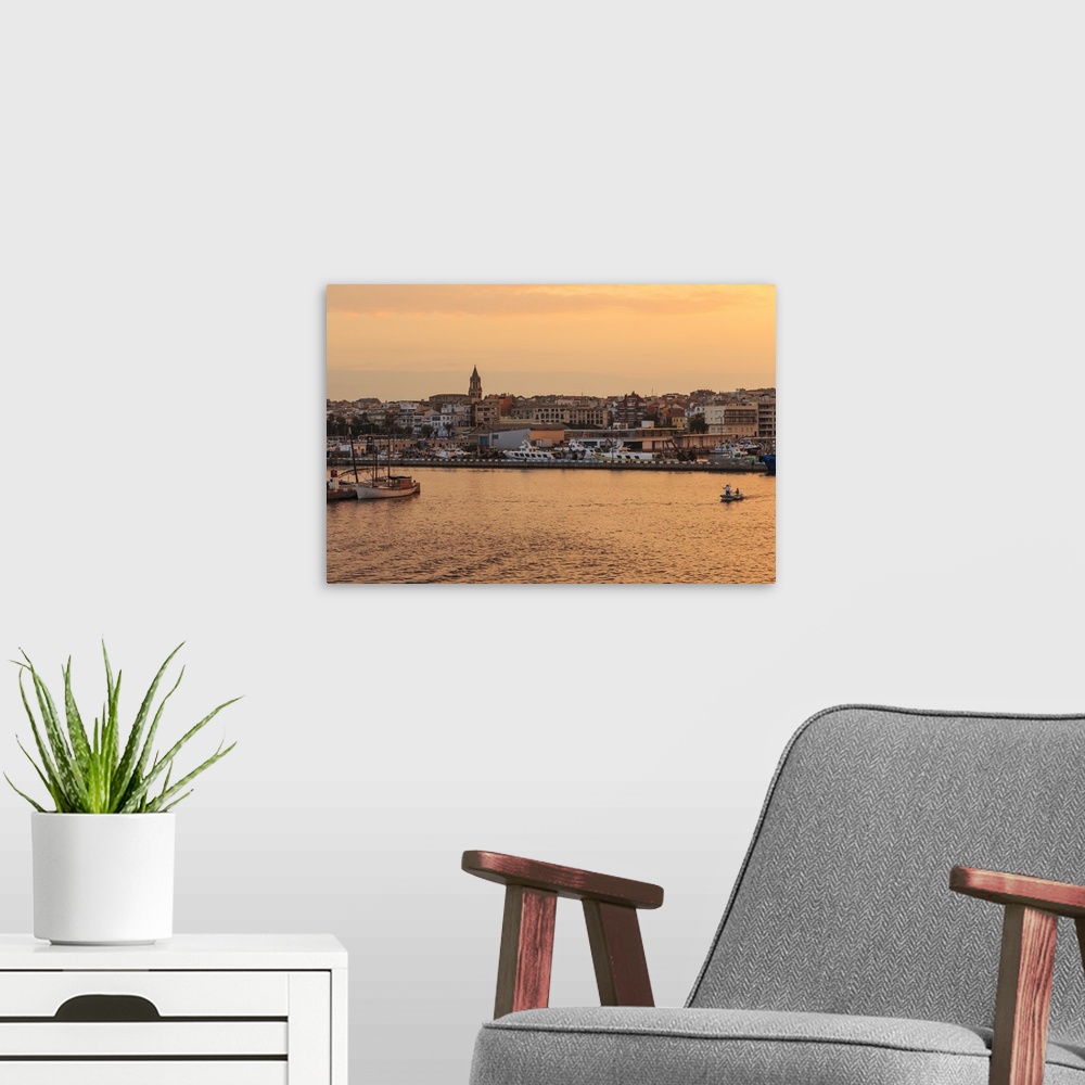 A modern room featuring Fishing boats and town at sunrise, Palamos, Costa Brava, Girona, Catalonia, Spain, Europe