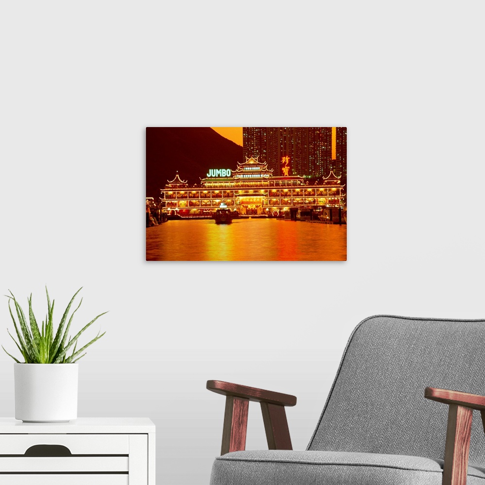 A modern room featuring Floating restaurant illuminated at night, Aberdeen Harbour, Hong Kong, China
