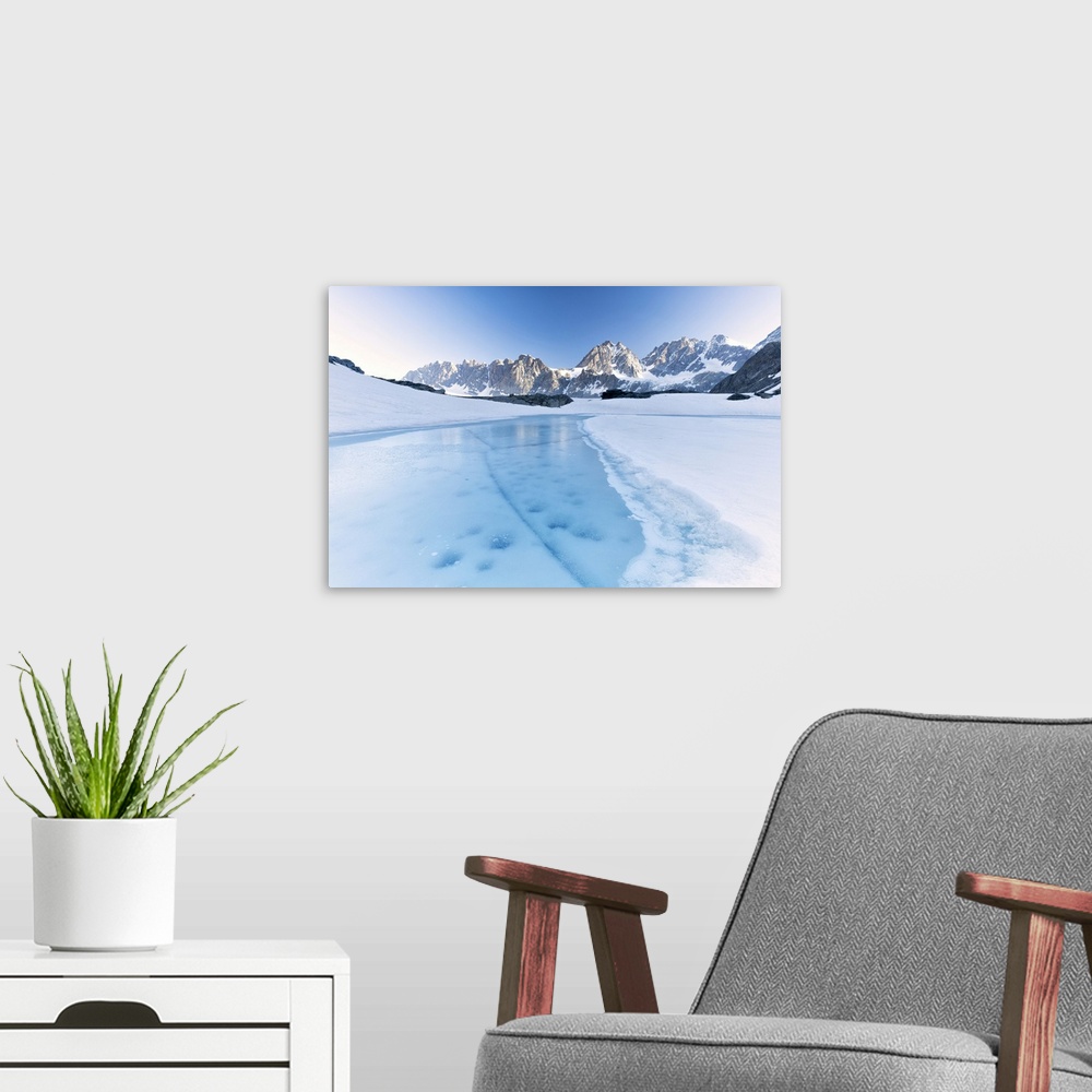 A modern room featuring Frozen water of Forbici Lake during the spring thaw, Valmalenco, Valtellina, Sondrio province, Lo...