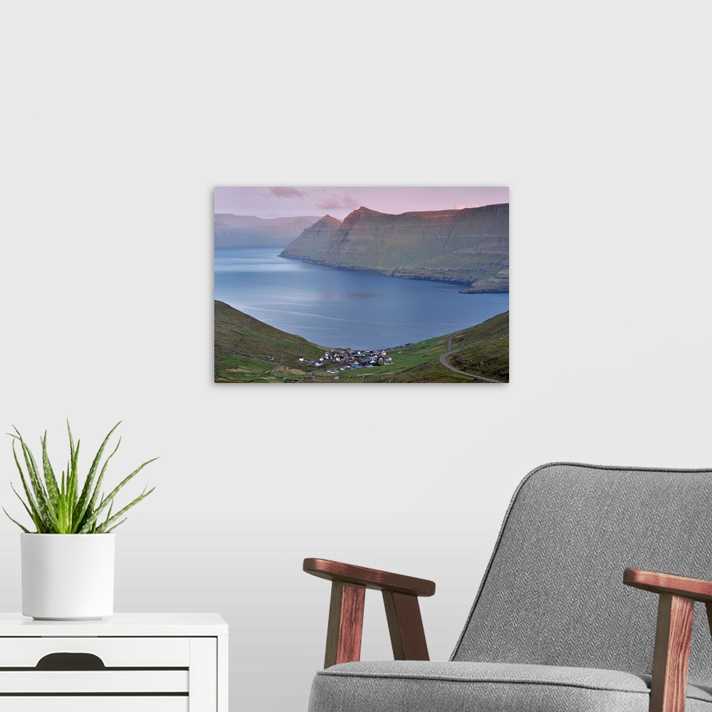 A modern room featuring Funningur in Funningsfjordur, with view on Eysturoy and Kalsoy  steep hills, at sunset. Eysturoy,...