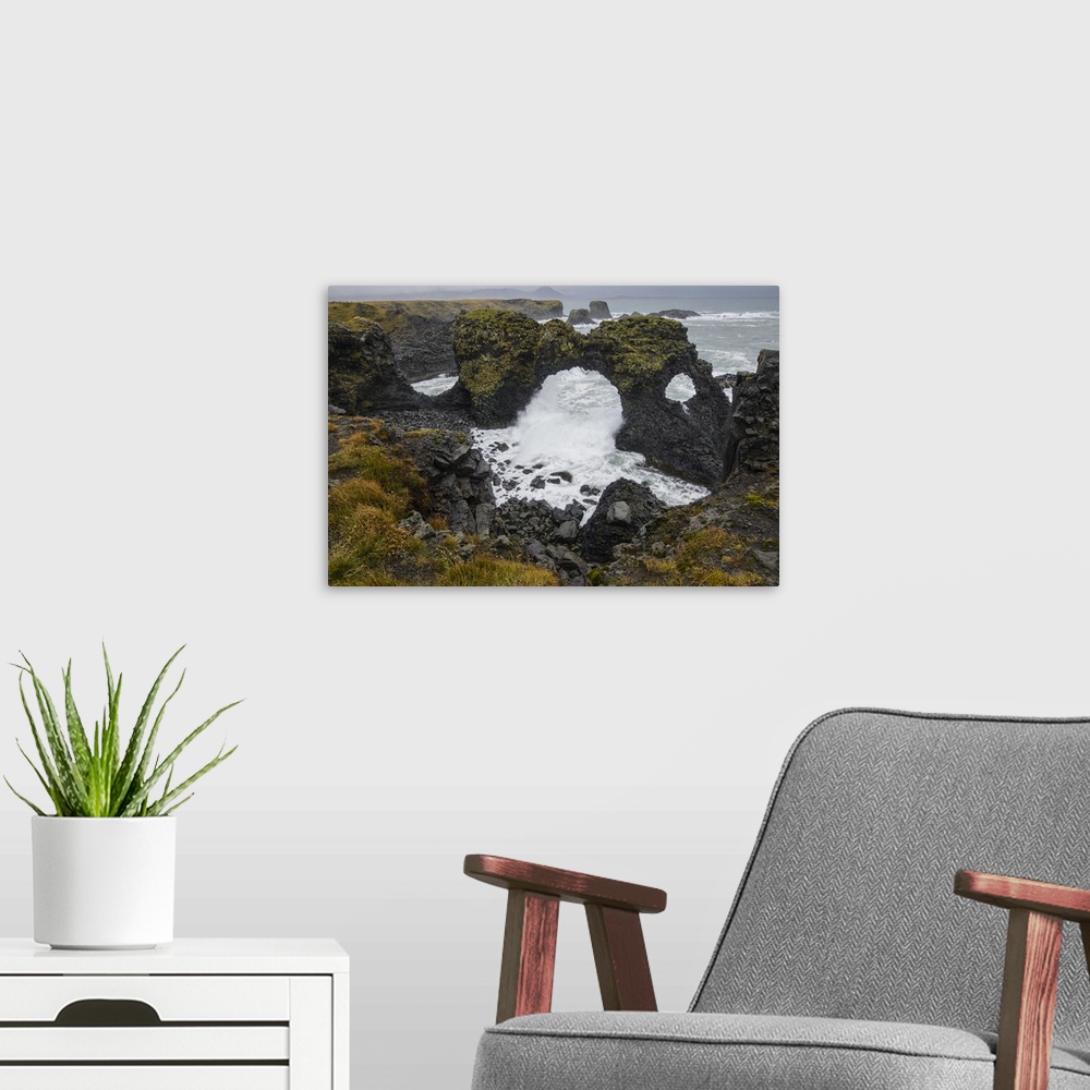 A modern room featuring Gatklettur basalt rock arch on the Snaefellsness Peninsula, Iceland, Polar Regions