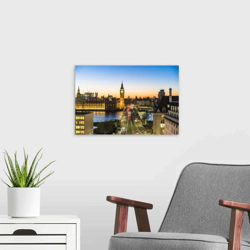 A modern room featuring View of Big Ben, the Palace of Westminster and Westminster Bridge at dusk, London, England