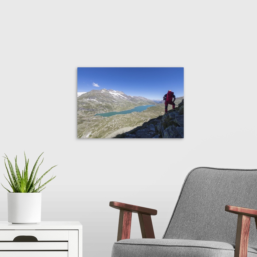 A modern room featuring Hiker admires the blue alpine lake from Pizzo Campaccio, Bernina Pass, Canton of Graubunden, Enga...