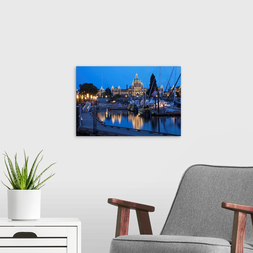 A modern room featuring Inner Harbour and Parliament Building, at night, Victoria, British Columbia, Canada