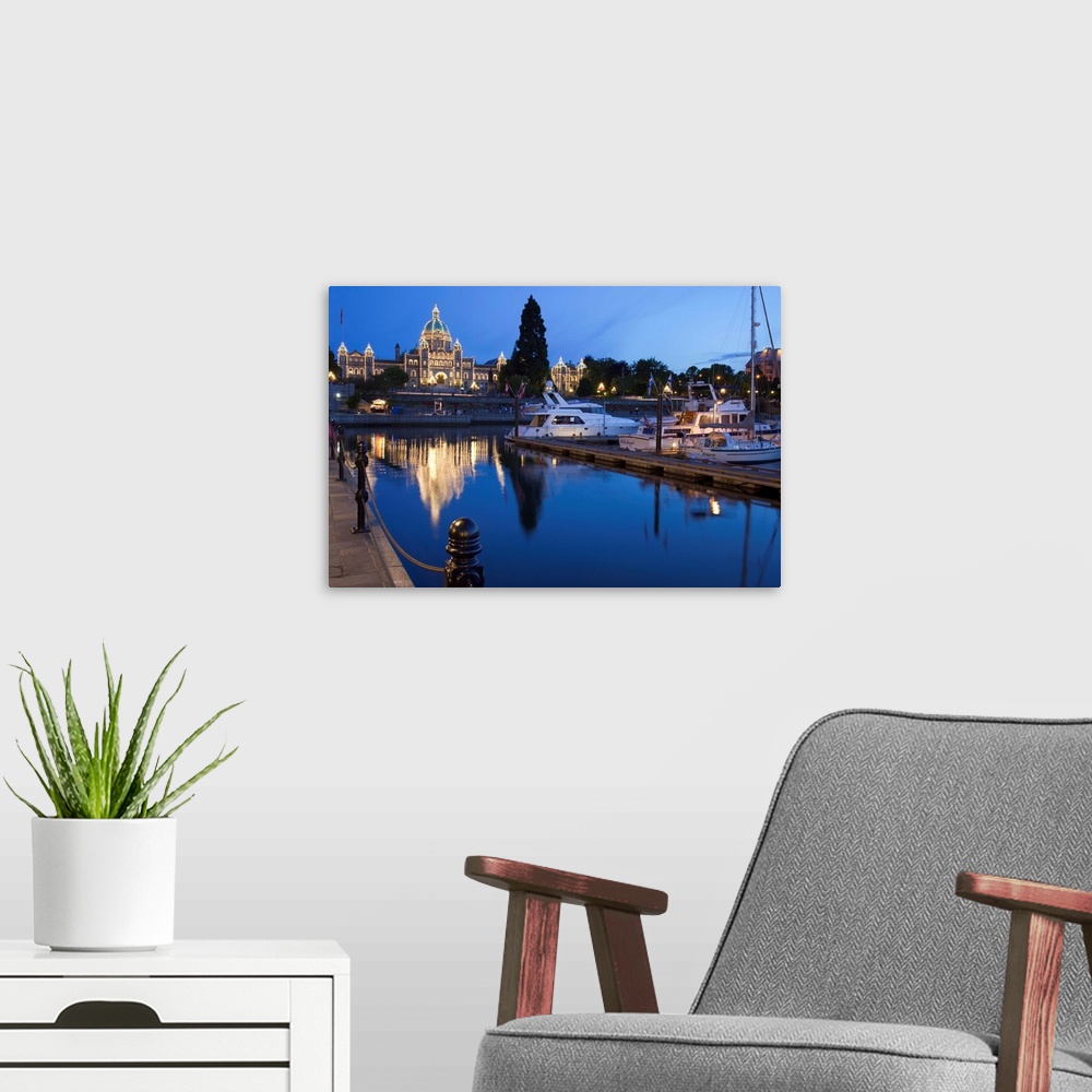 A modern room featuring Inner Harbour and Parliament Building, at night, Victoria, British Columbia, Canada