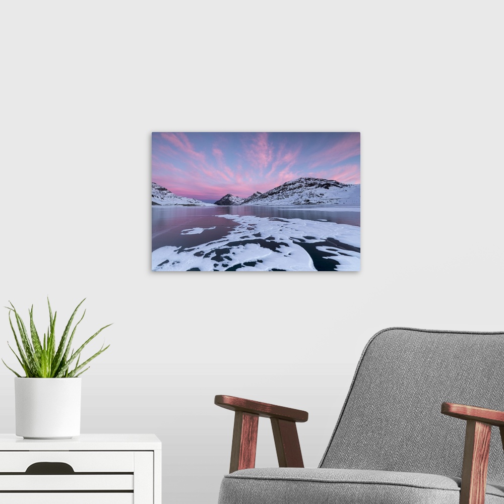 A modern room featuring The frozen Lago Bianco framed by pink clouds at dawn, Bernina Pass, canton of Graubunden, Engadin...