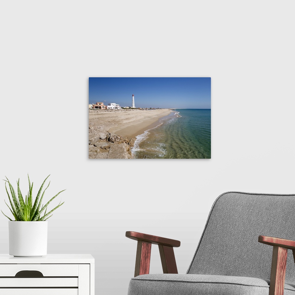 A modern room featuring Lighthouse and beach of Ilha do Farol, Culatra barrier island, Olhao, Algarve, Portugal