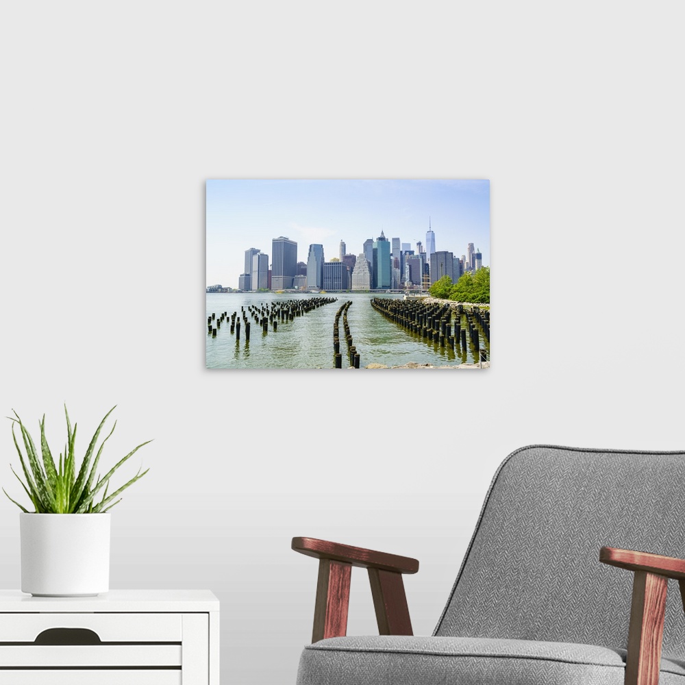 A modern room featuring Manhattan skyline viewed from Brooklyn Bridge Park, New York City, United States of America, Nort...