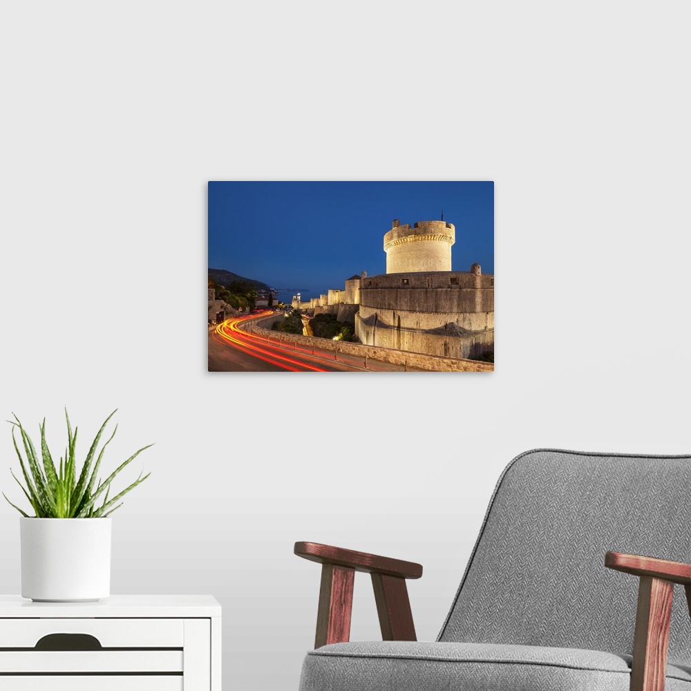 A modern room featuring Minceta tower and city walls with traffic light trails, Dubrovnik Old Town, Dubrovnik, Dalmatian ...